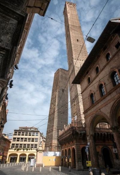 The Garisenda, left, and Asinelli towers in Bologna, Italy. Massimo Paolone/AP