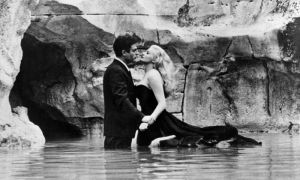 The iconic scene of the movie “La Dolce Vita”- in the Trevi Fountain.