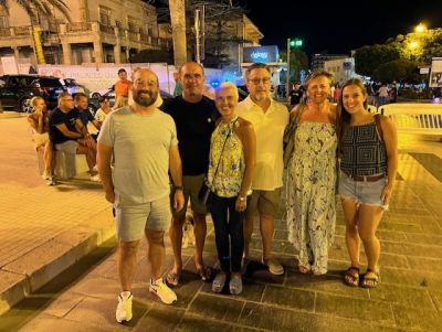 Raymond is standing on the left and the missing link, Angela, is on the far right.