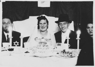 Two internees celebrate their wedding in the Ferramonti camp in a lunchtime ceremony performed by Rabbi Riccardo Pacifici (far left). United States Holocaust Memorial Museum, courtesy of Emanuele Pacifici
